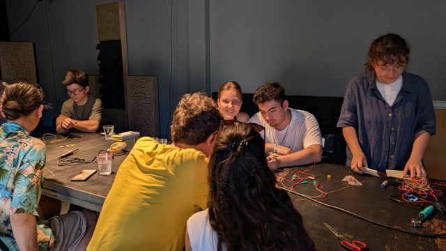 Deep in group discussion, troubleshooting and making circuit designs for piezo-powered harvesters